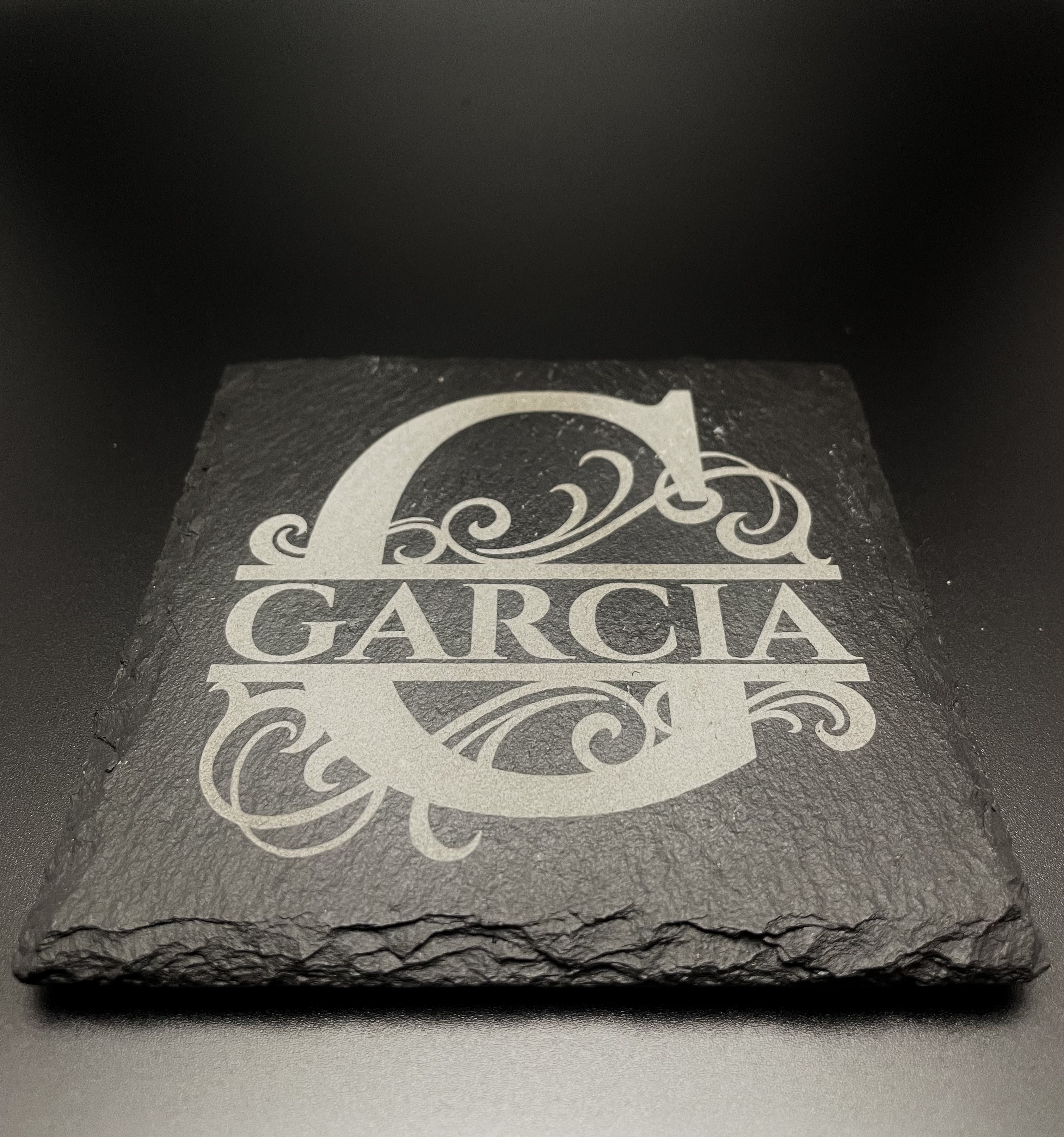 Close-up of the Garcia split-monogram slate coaster